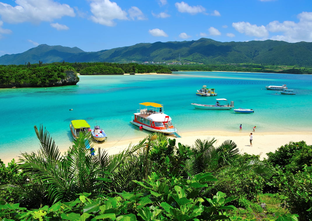 Kabira Bay, Okinawa in summer, aerial view of beautiful landscape, tourism boats