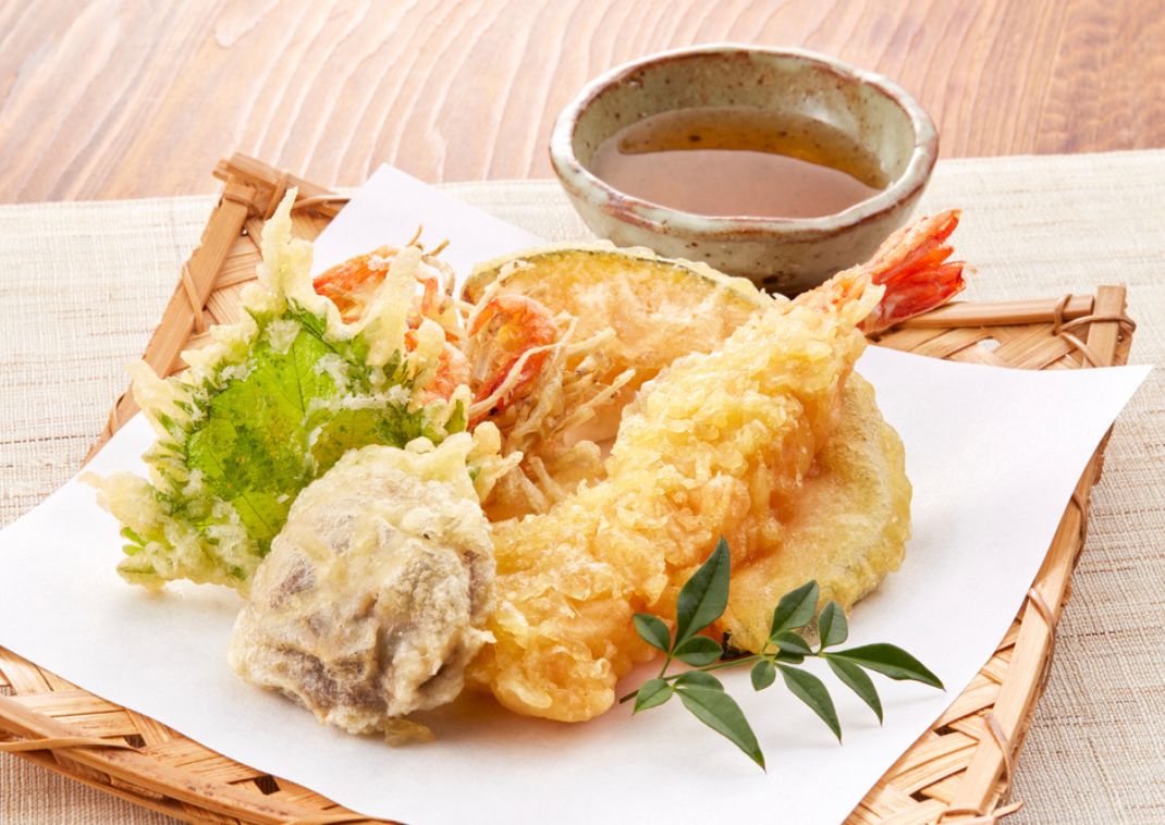 Japanese tempura served with a dipping sauce