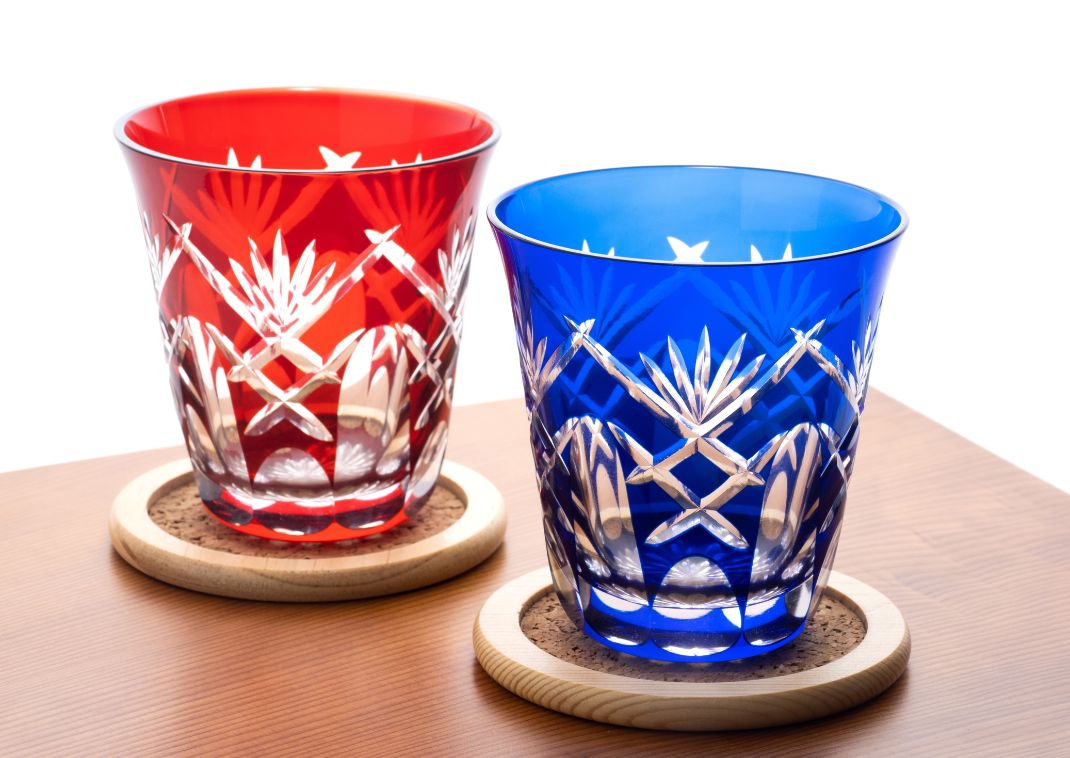 Traditional Tokyo craft of two red and blue Edo Kiriko glasses