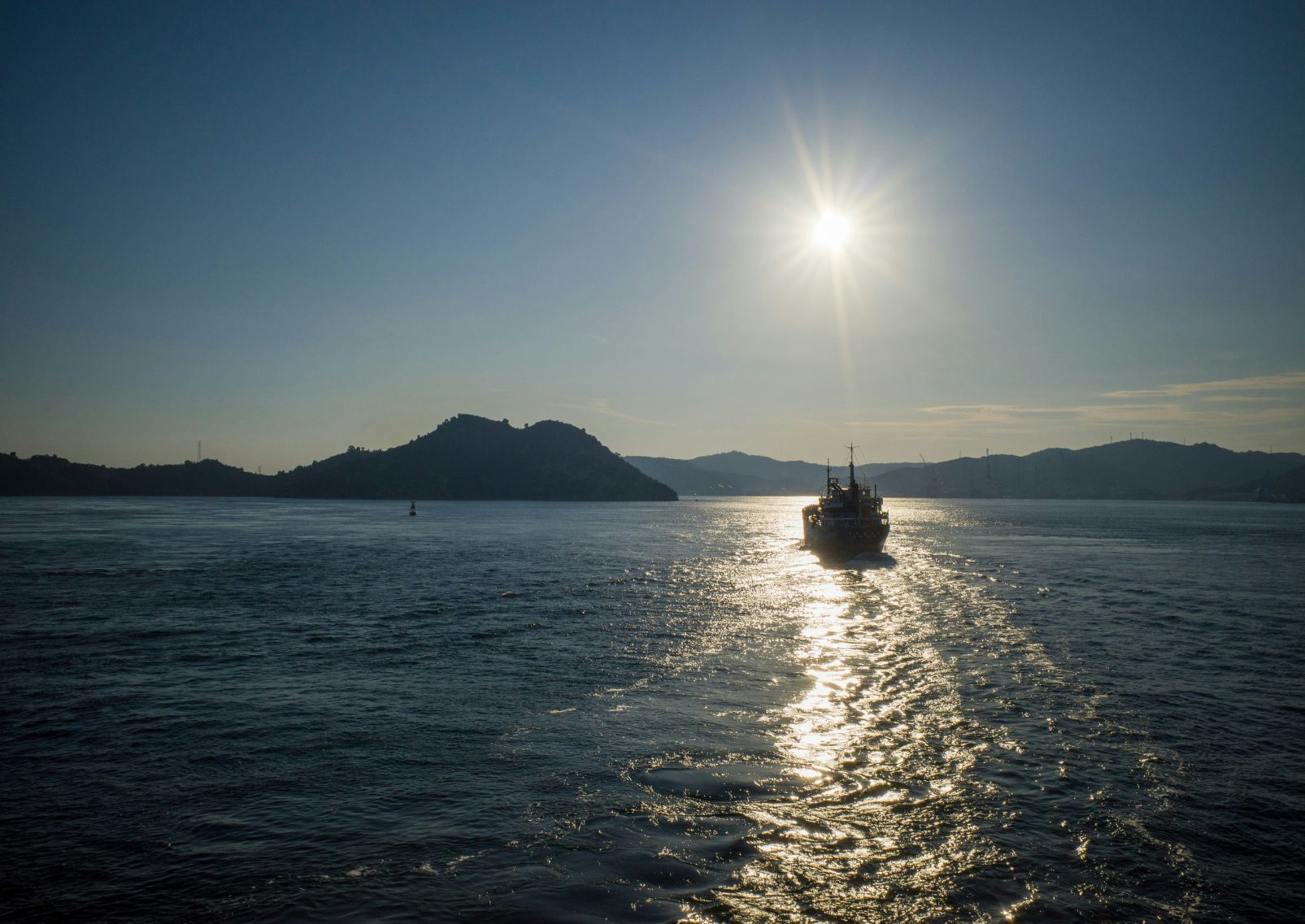 A top-down view of a ferry coming into Naoshima Island