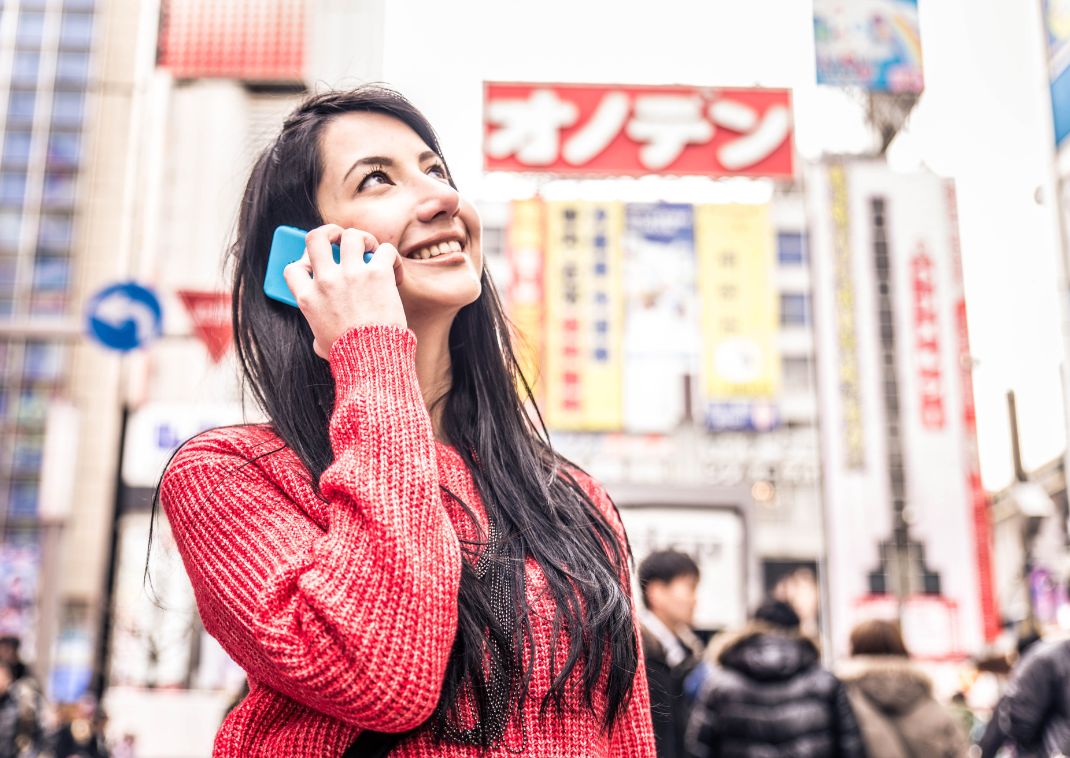 Woman talking on the phone in Tokyo, Japan