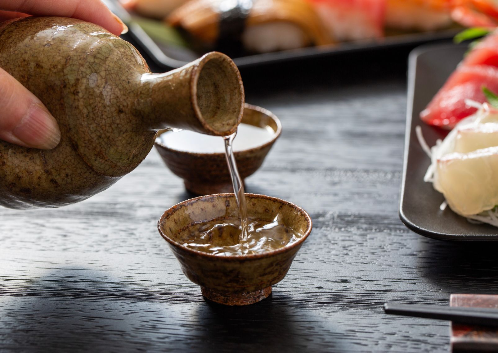 Pouring Japanese sake