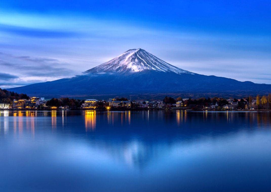 Snow-capped Mt Fuji reflected in Kawaguchiko lake
