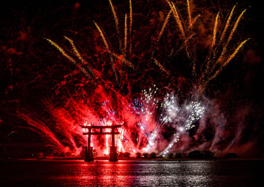 the Betenjima torii gate lit from summer fireworks