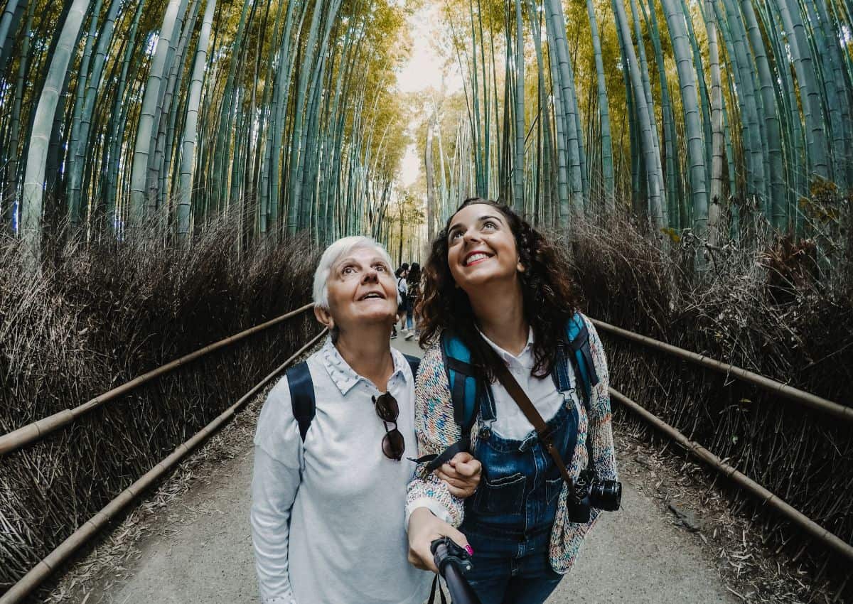 Mother and daughter tourists in Arashiyama Bamboo Grove, Kyoto