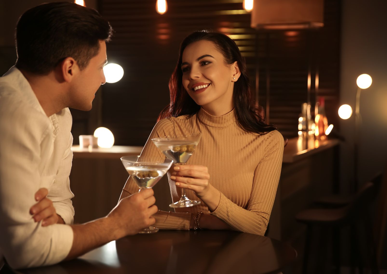 Man and woman drinking cocktails in a bar, Japan