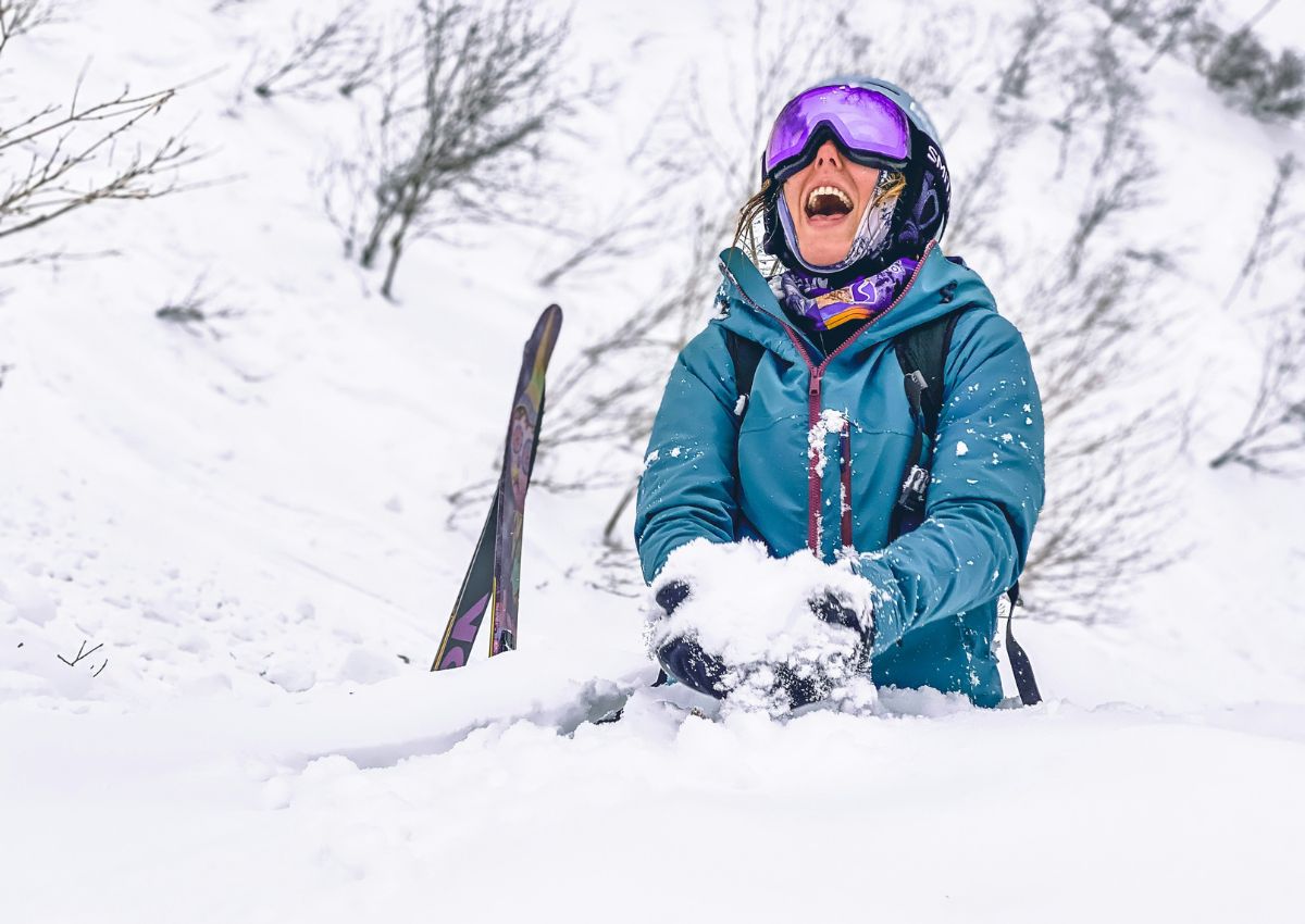 Girl playing with snow in Niseko, Hokkaido