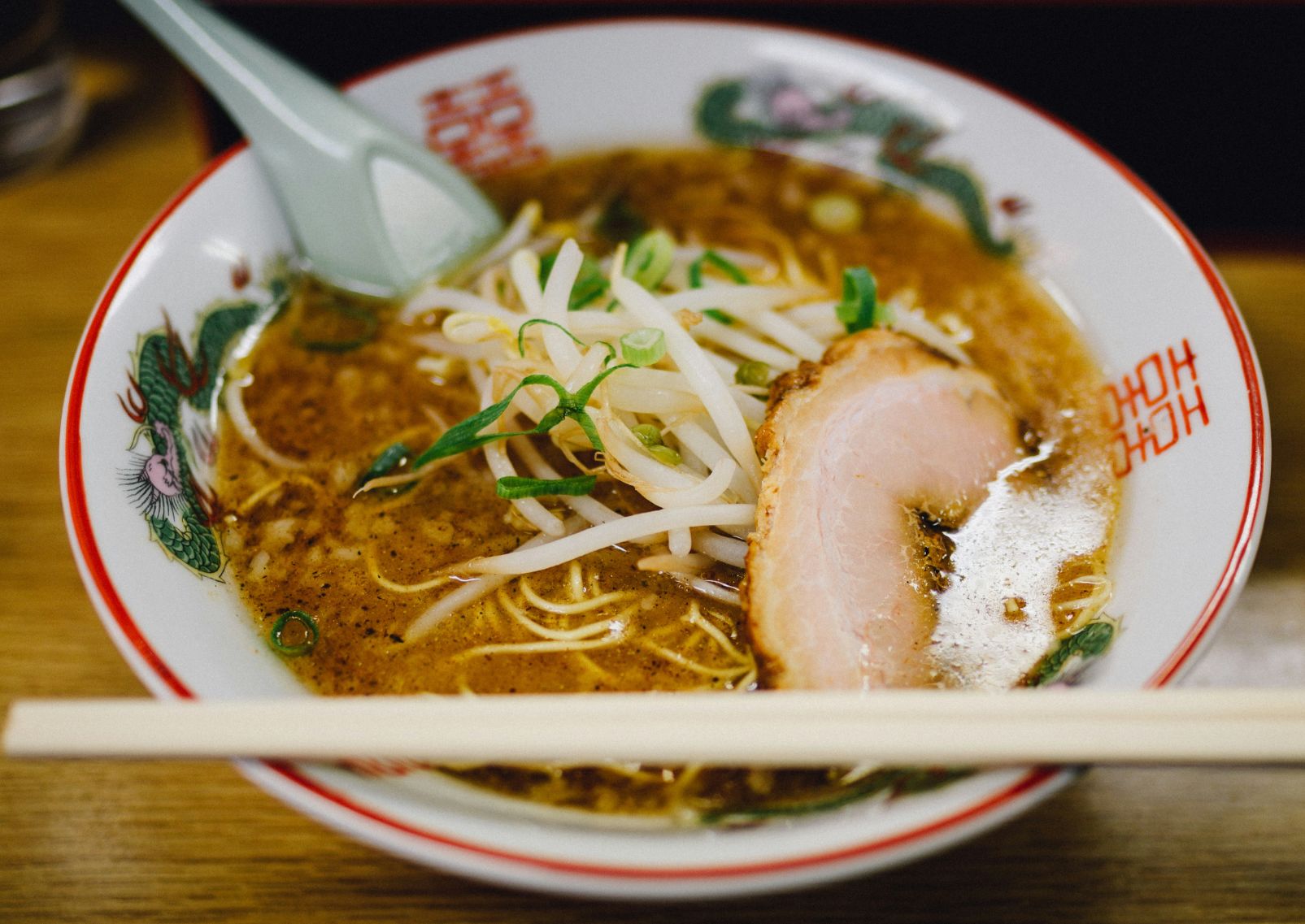 Japanese pork ramen served in a traditional bowl eaten with chopsticks