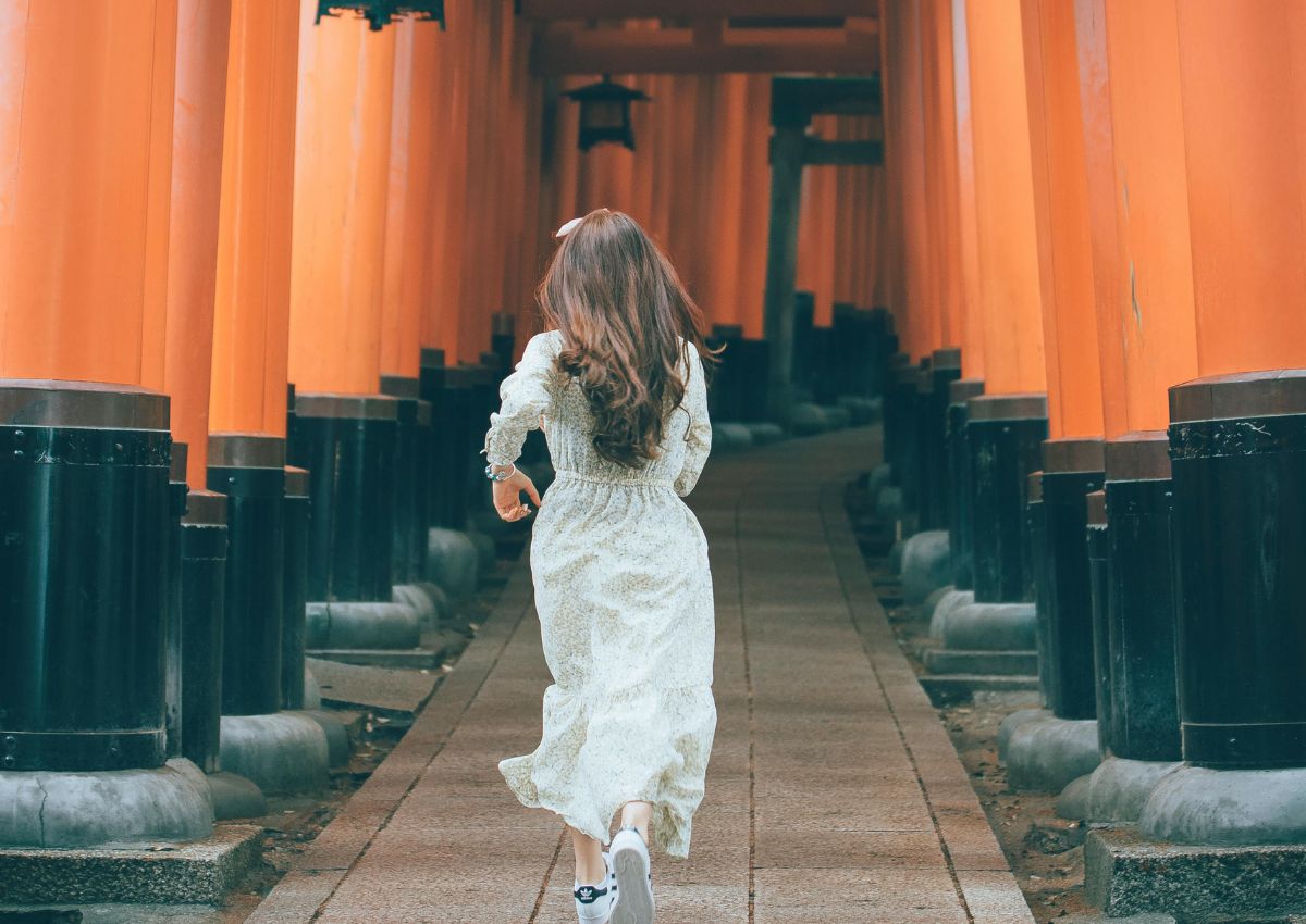 Girl running in Fushimi Inari shrine,Kyoto 