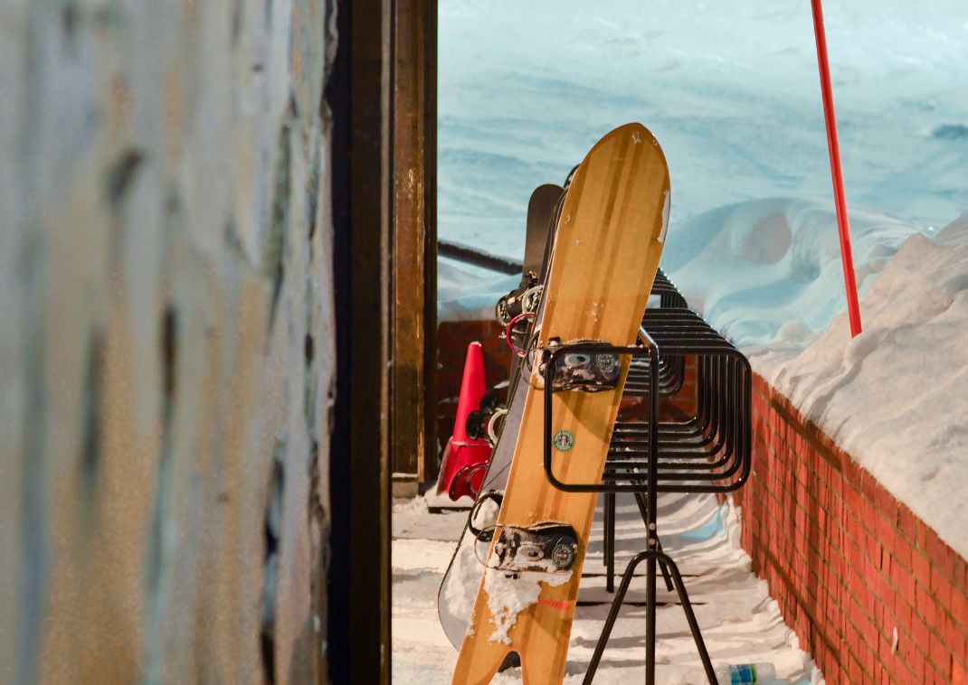 Ski and snowboards propped against a restaurant in Niseko, Hokkaido, Japan