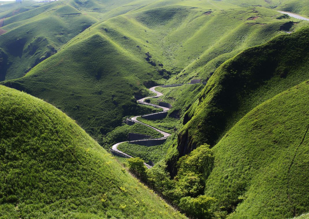 Road in Mt Aso’s greenery, Japan