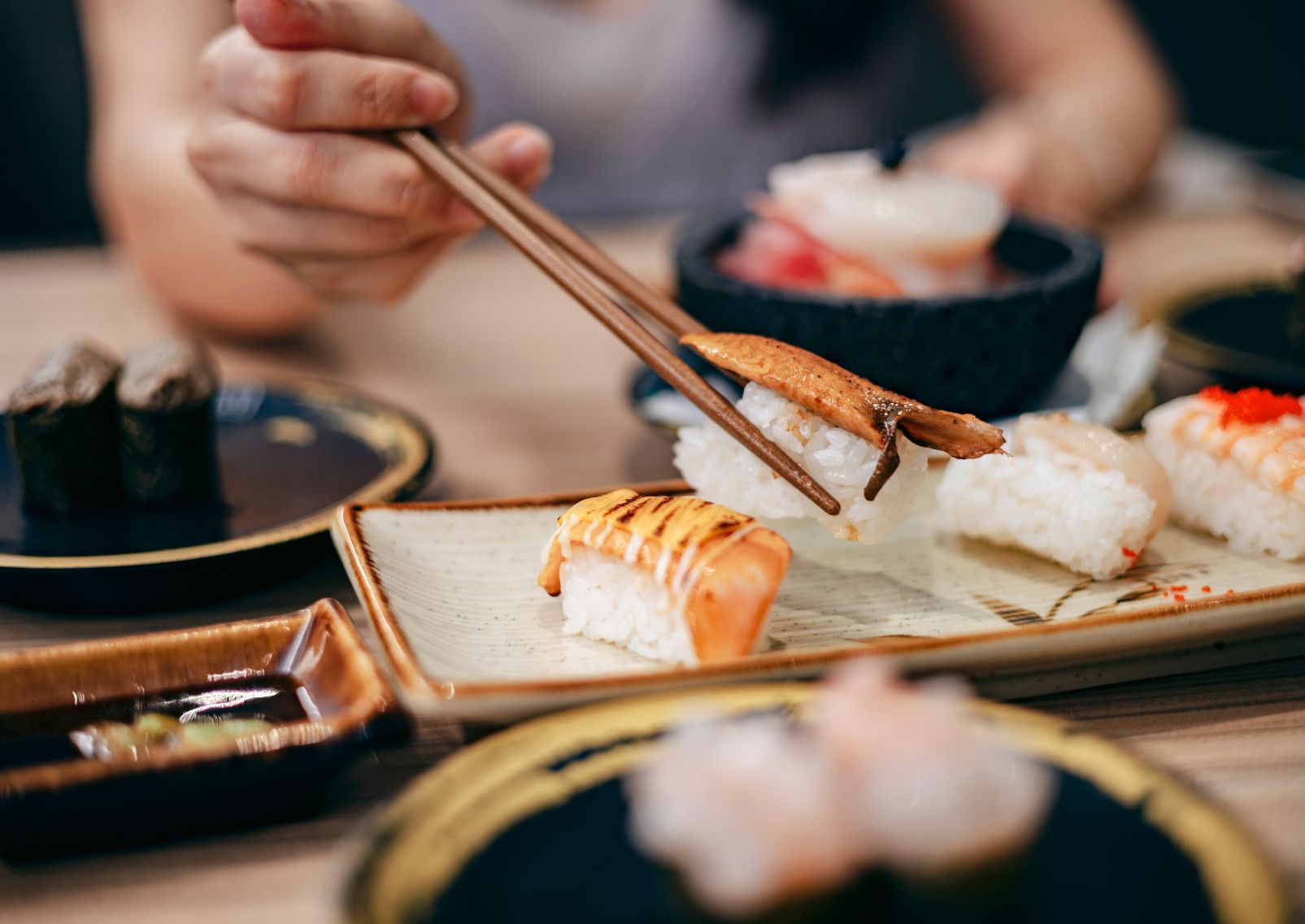 Japanese sushi being shared with friends