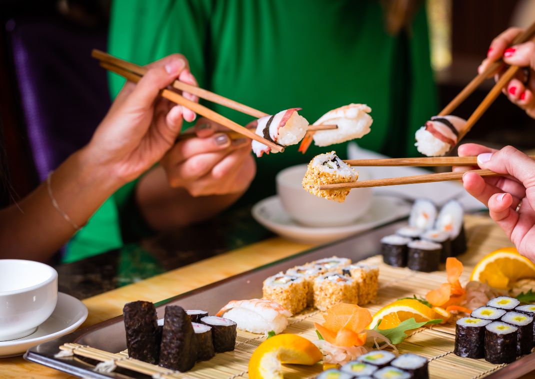 Japanese sushi being shared with friends