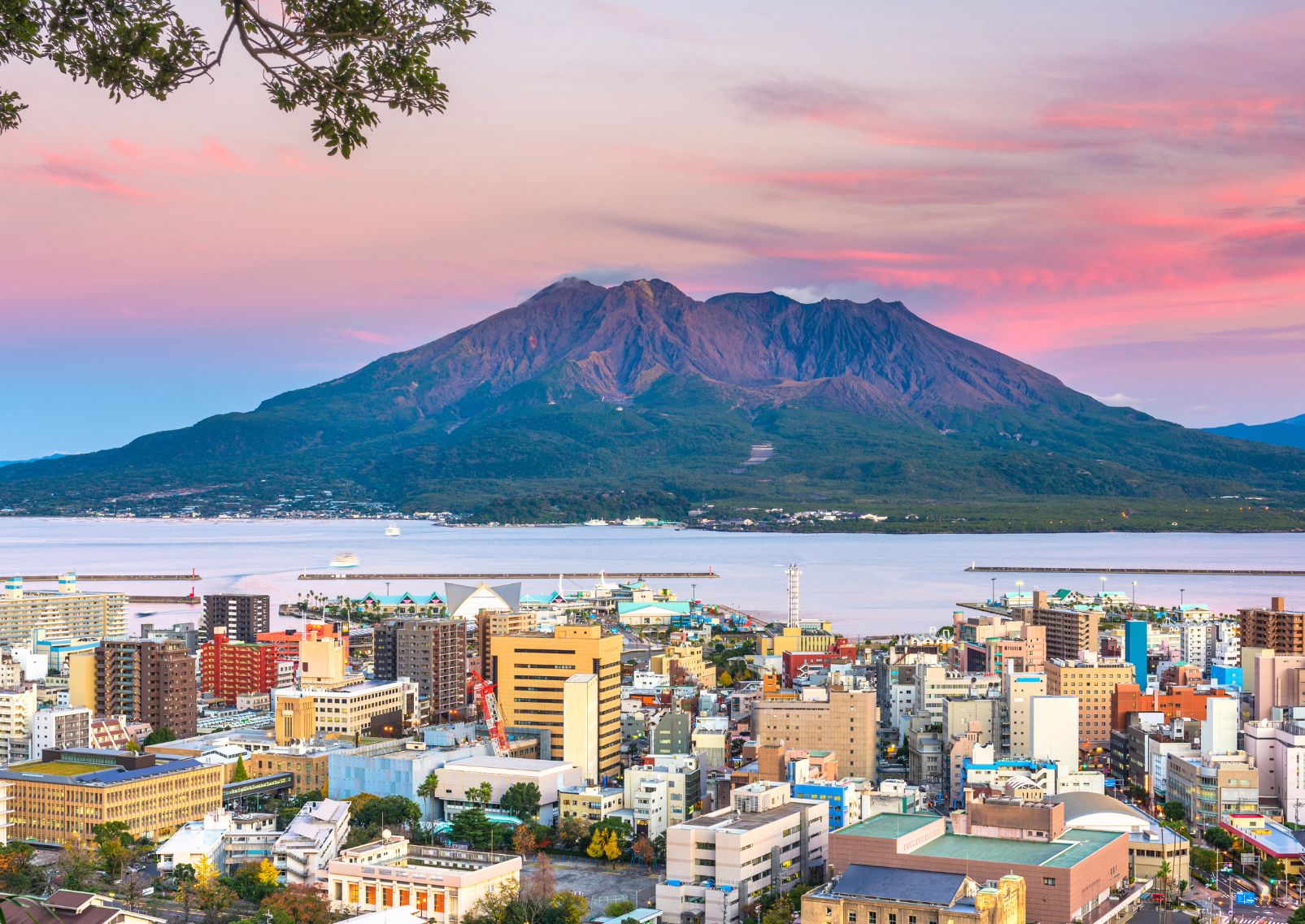 City skyline with Sakurajima Volcano at dusk in Kagoshima