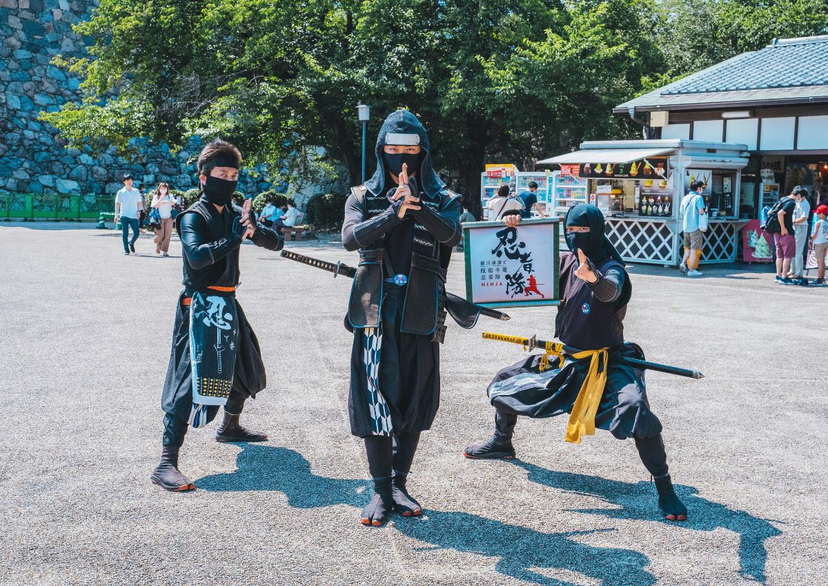 Men dressed in ninja suits at Nagoya Castle, Japan