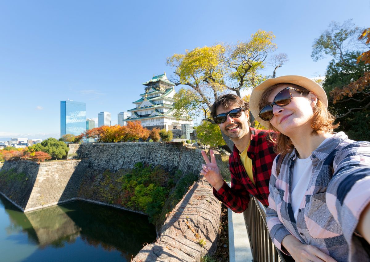 Couple in front of Osaka Castle, Japan