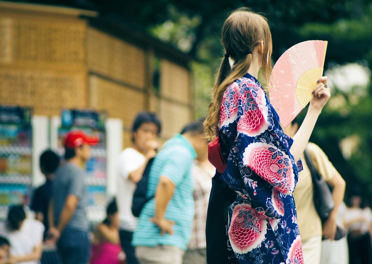 Girl wearing yukata at summer festival in Japan
