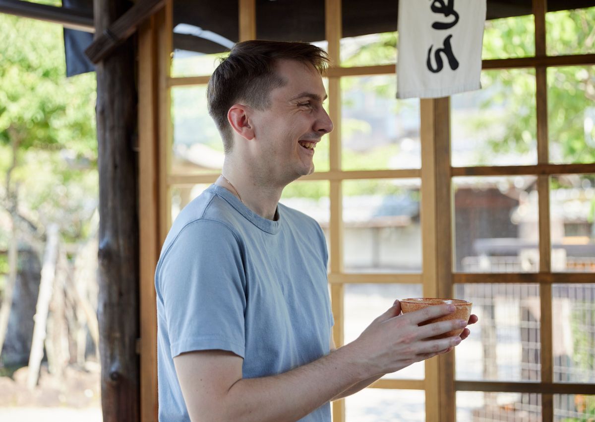 Tourist man enjoying a bowl of matcha in Japan