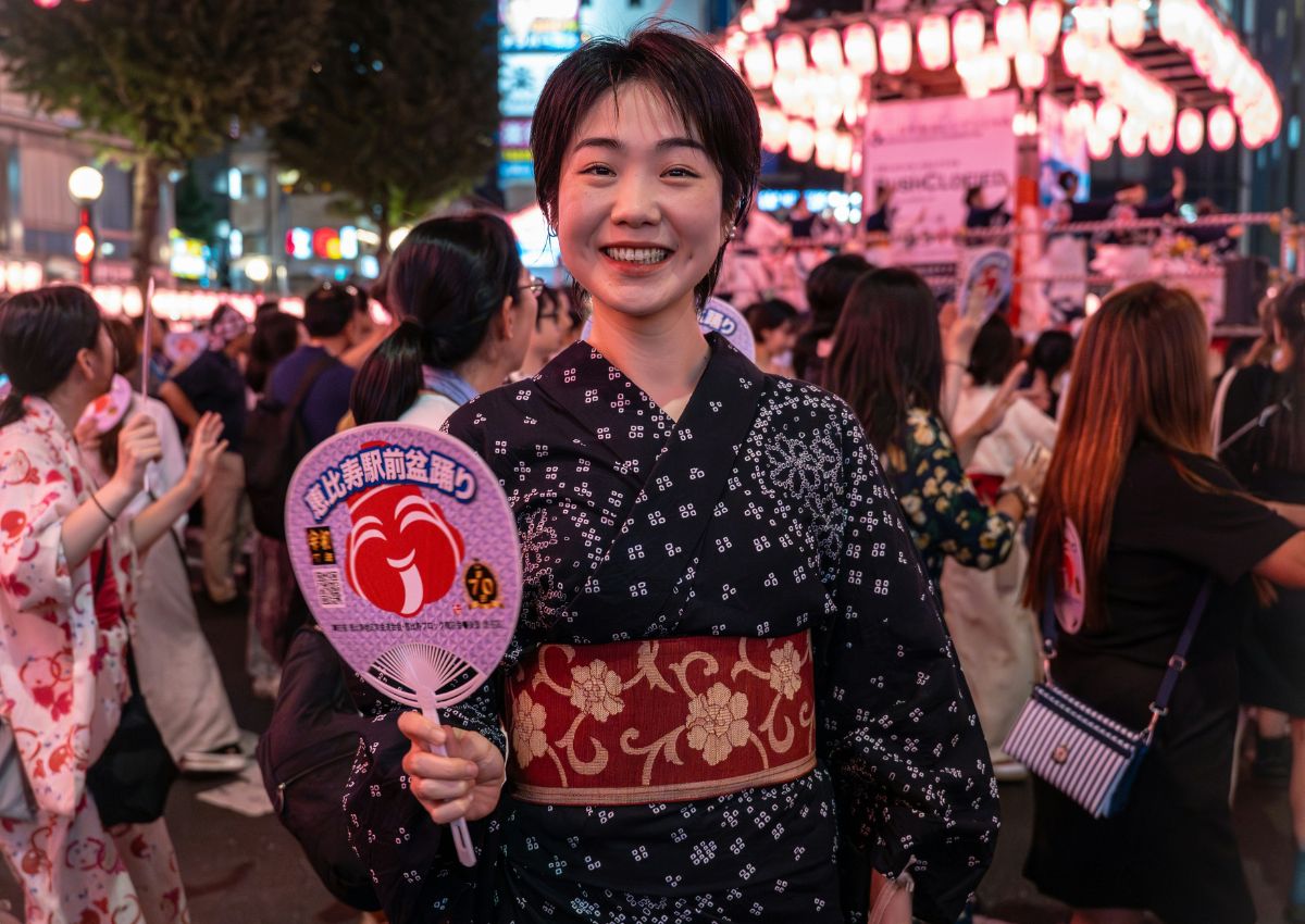 Japanese girl at Obon Festival with fan