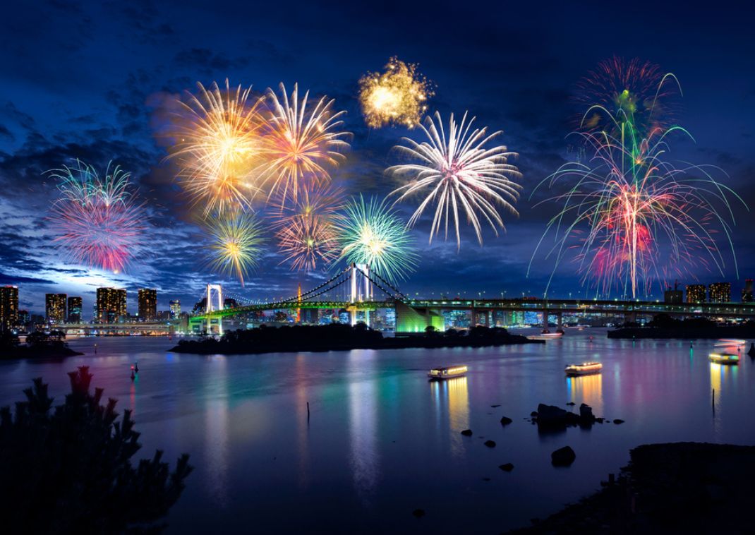 View of Tokyo Bay and Tokyo Rainbow Bridge with beautiful fireworks.