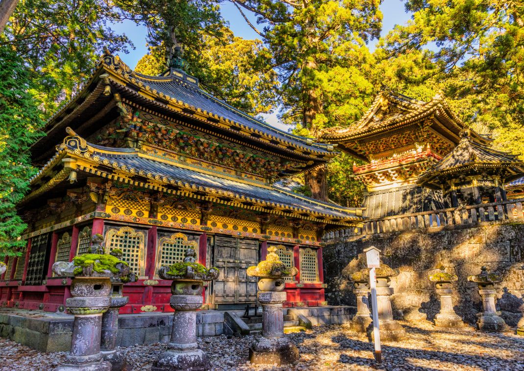 Nikko’s elaborate Toshogu Shrine with golden decorations in dappled light