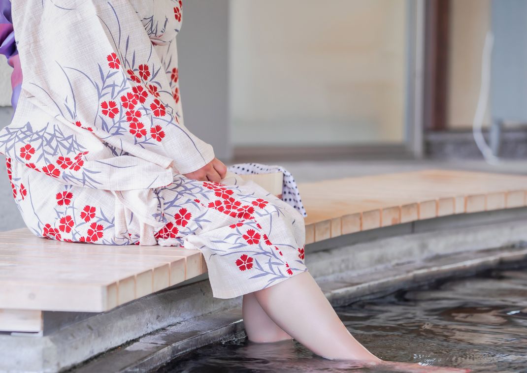 Lady in Japanese yukata foot bathing, Japan