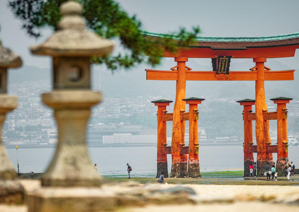 Tourists around Miyajima Island’s floating torii gate