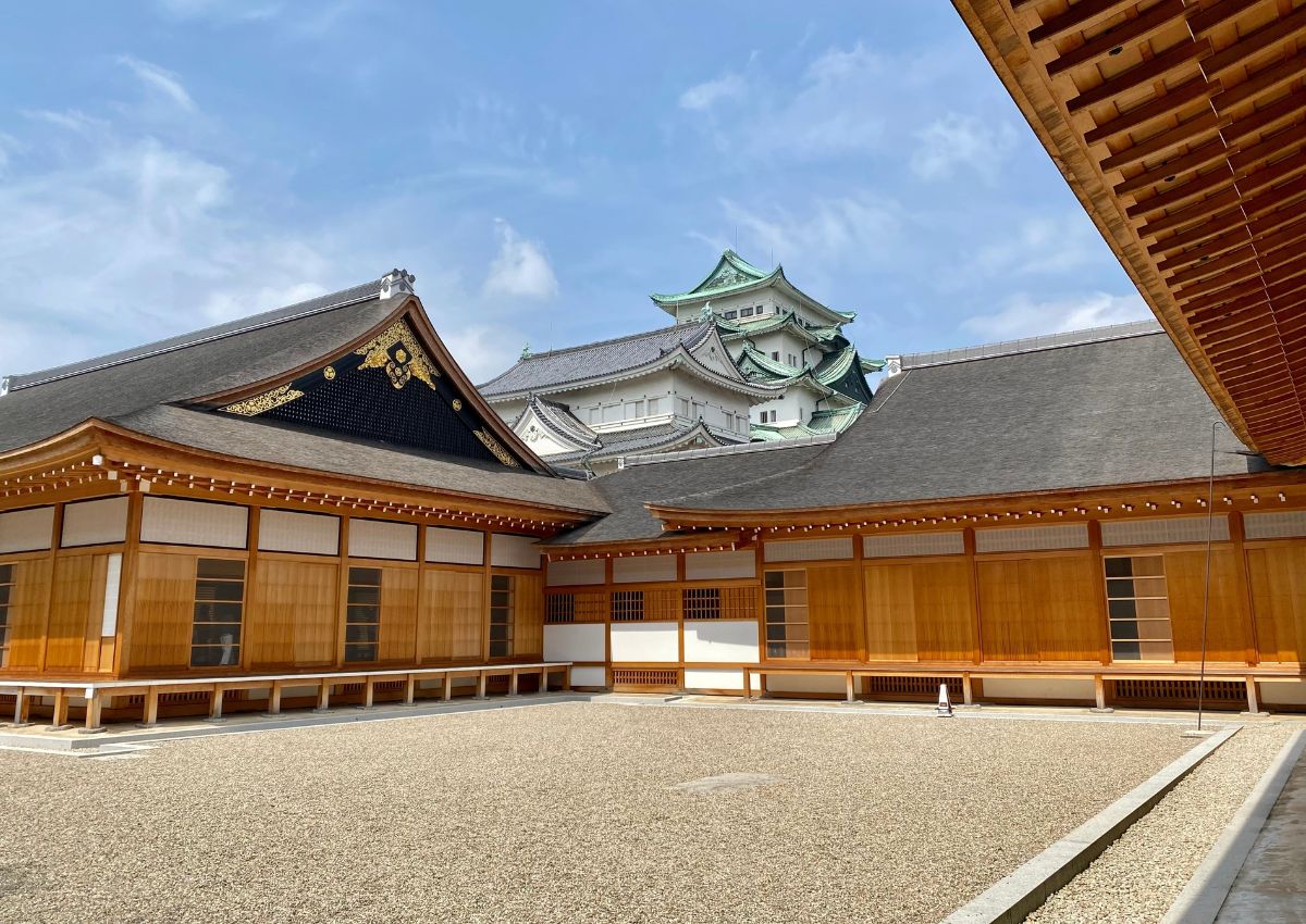 Nagoya Castle from between wooden buildings