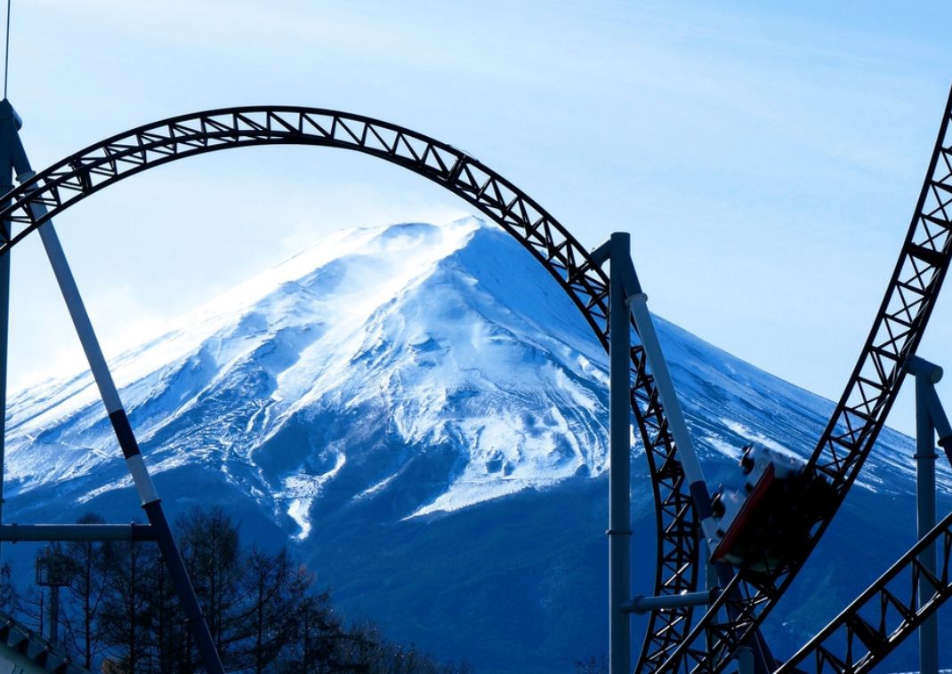 Roller coaster in front of Mt. Fuji at Fuji-Q Highland theme park