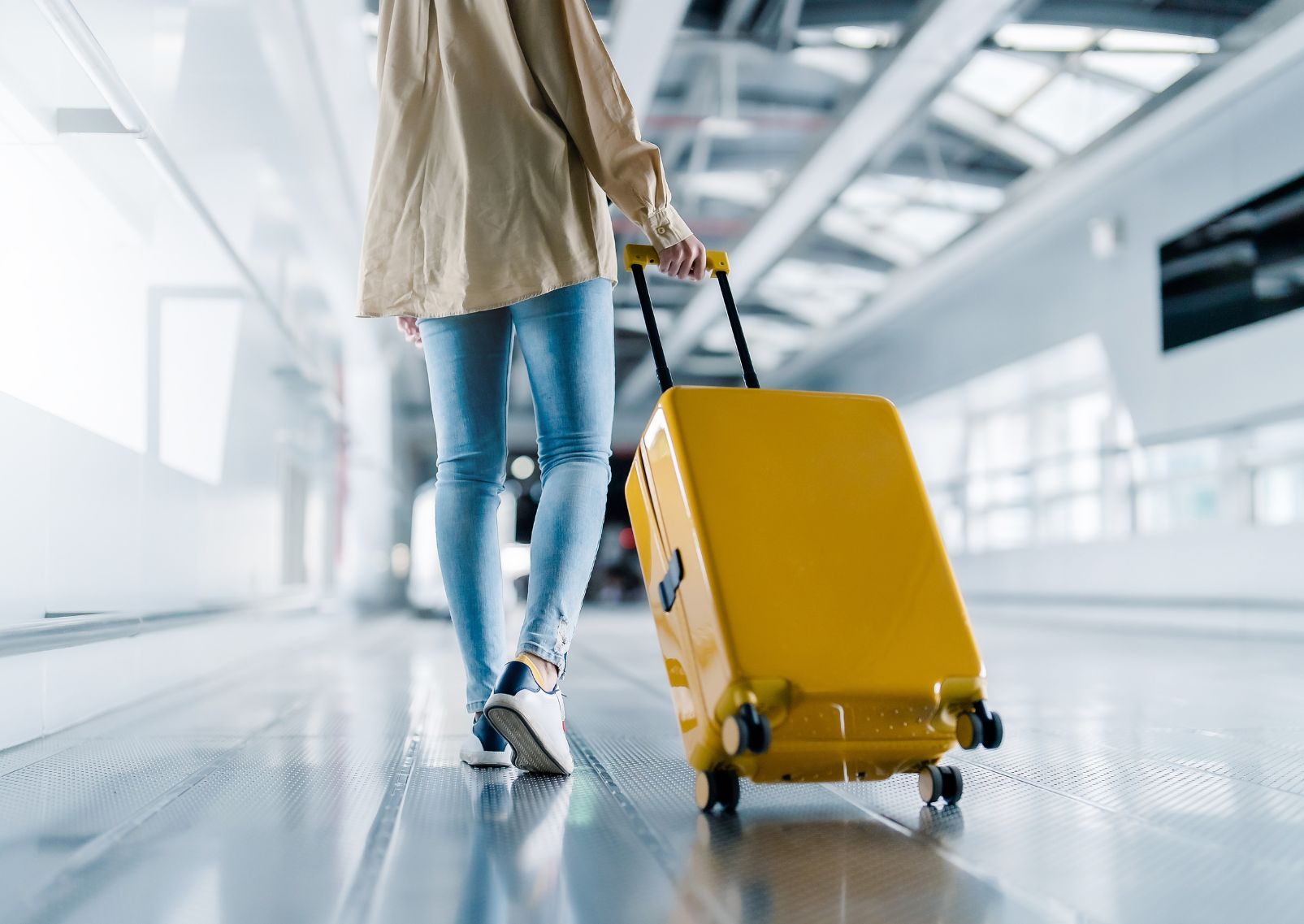 Airport terminal with arriving woman