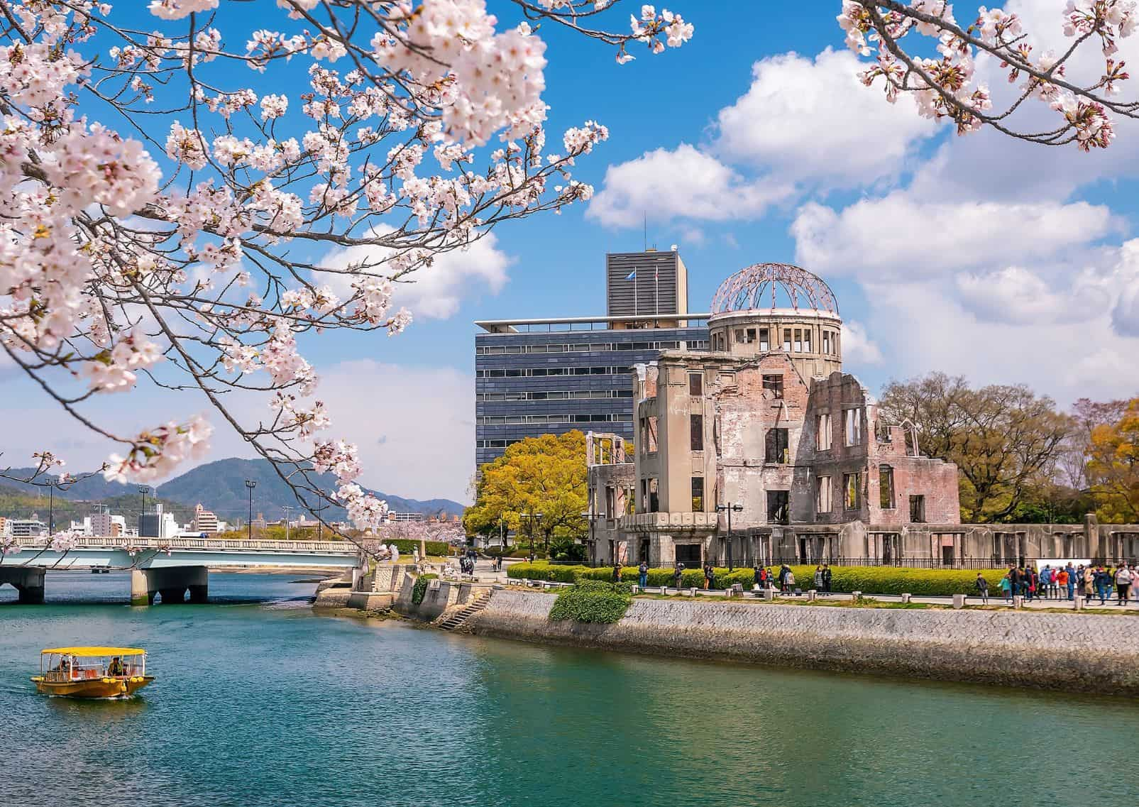 Hiroshima Atomic Bomb Dome and cherry blossom trees framing it