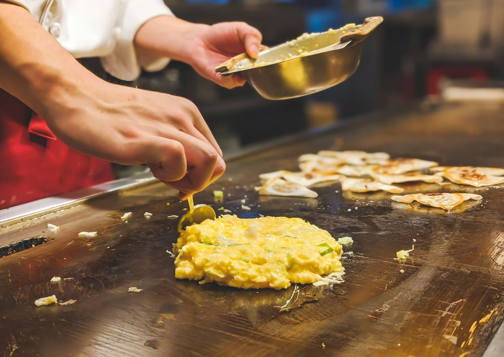 Making a Hiroshima-style okonomiyaki, Japan