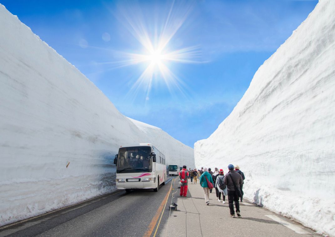 Snow Wall on Tateyama Kurobe alpine with blue sky background