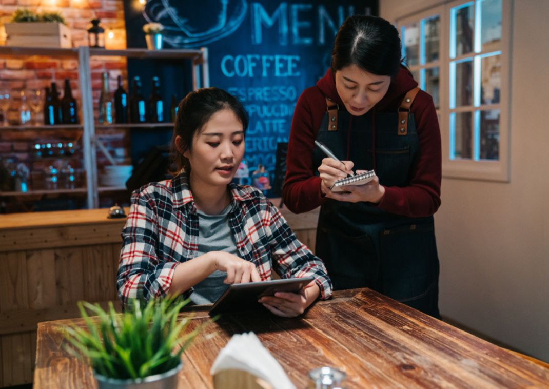 Woman ordering at a restaurant