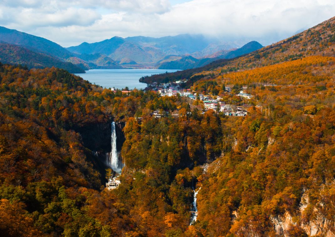 Autumn colours in wide-angle view of Nikko featuring Lake Chuzenji and Kegon Waterfall