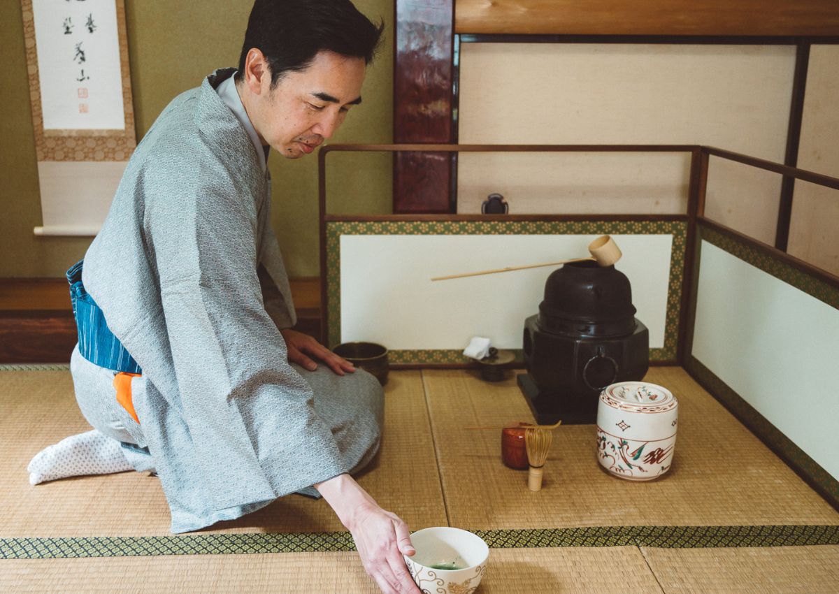 Man serves tea during Japanese tea ceremony