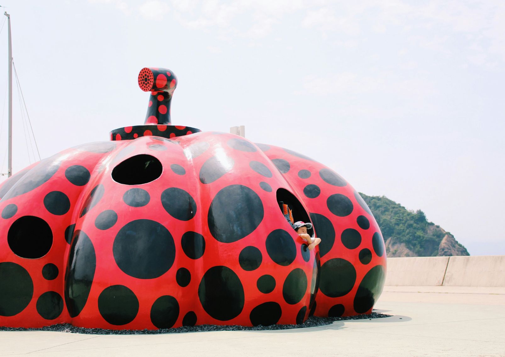 Yayoi Kusama’s Red Pumpkin statue on Naoshima Island, Japan 
