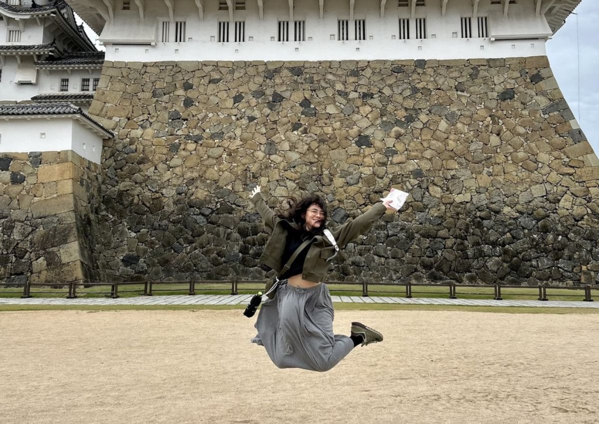 Ambre in front of Himeji Castle, Japan