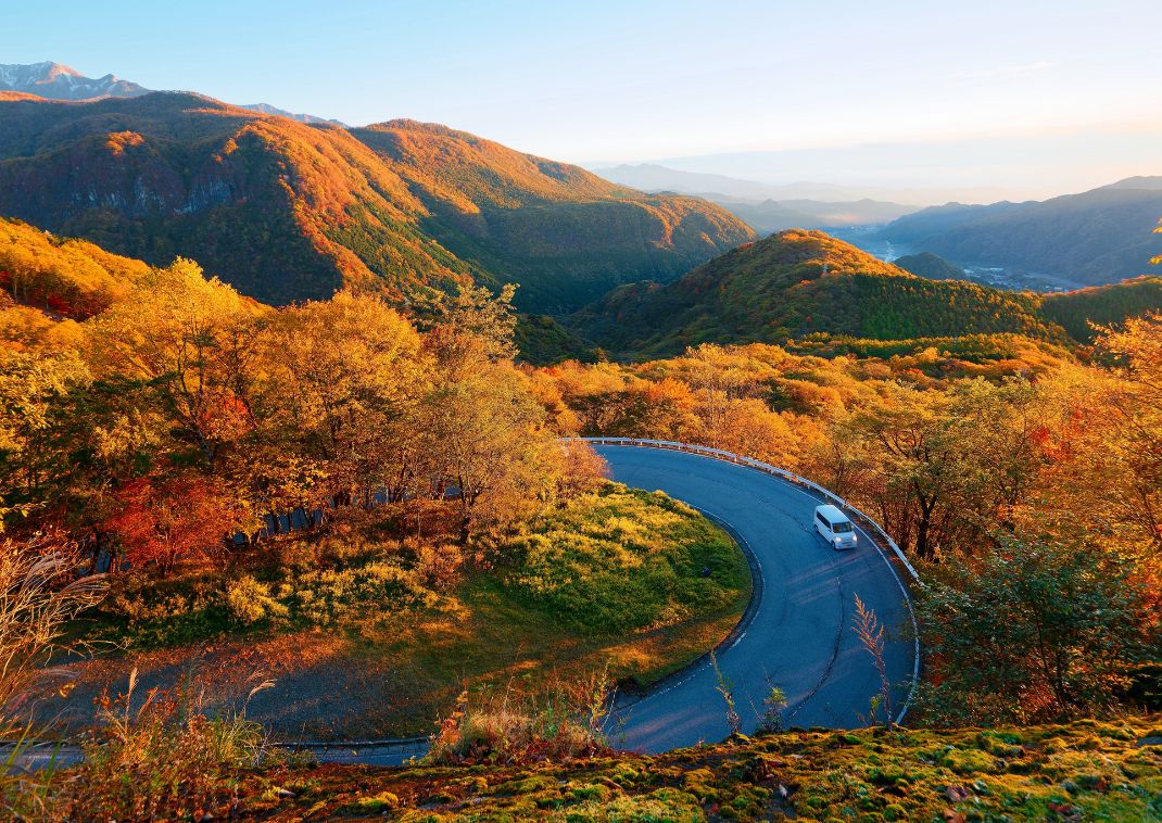 Aerial view of car on Irohazaka, a mountain highway connecting Lake Chuzenji to Nikko, Tochigi, Japan