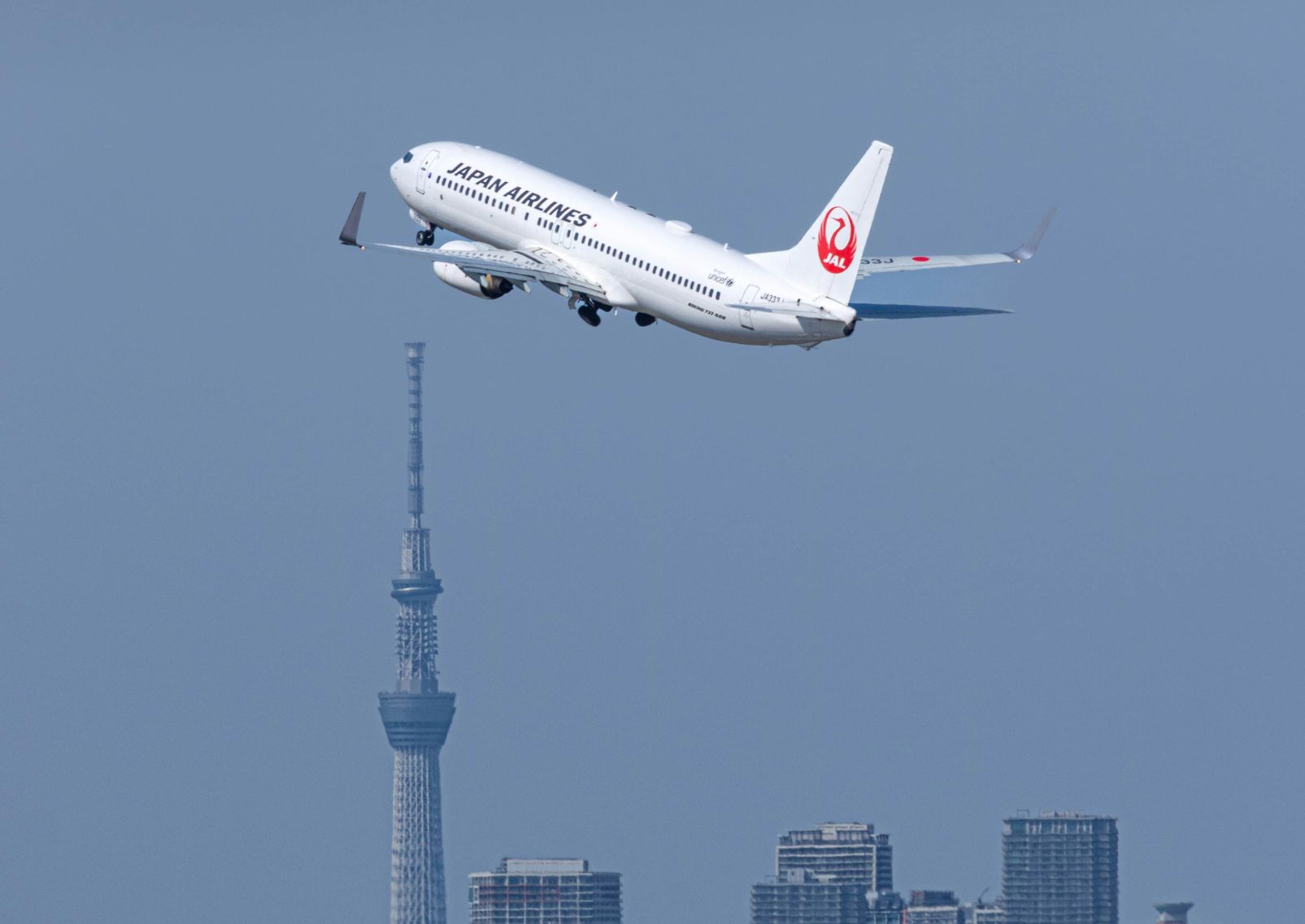 Plane flying over Tokyo, Japan