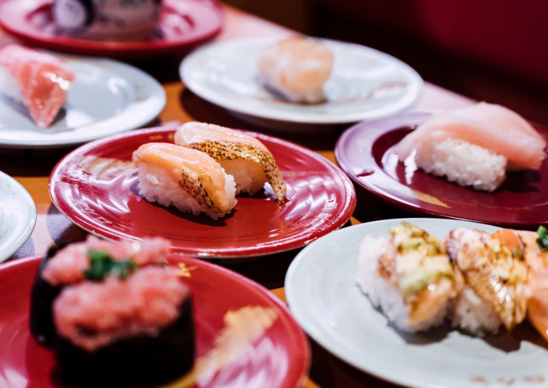 Different types of sushi on small plates