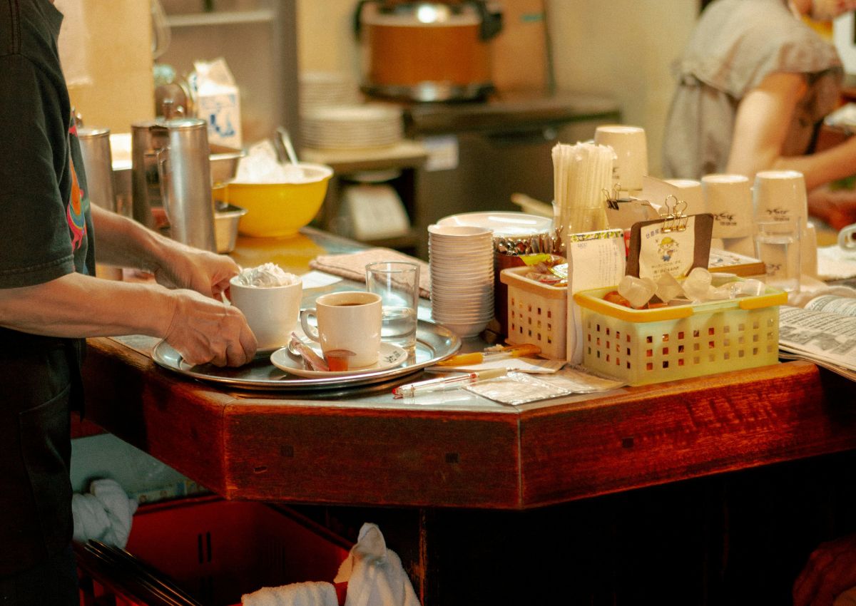 Shopkeeper providing customer service in a Japanese kissaten