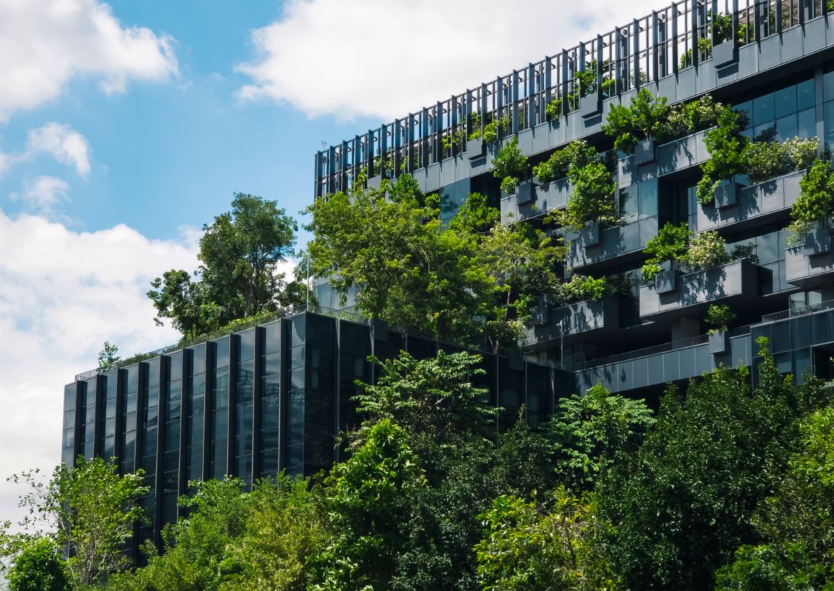 Sustainable green building Eco-friendly glass facade design with tree Ecology Health Well-being concept