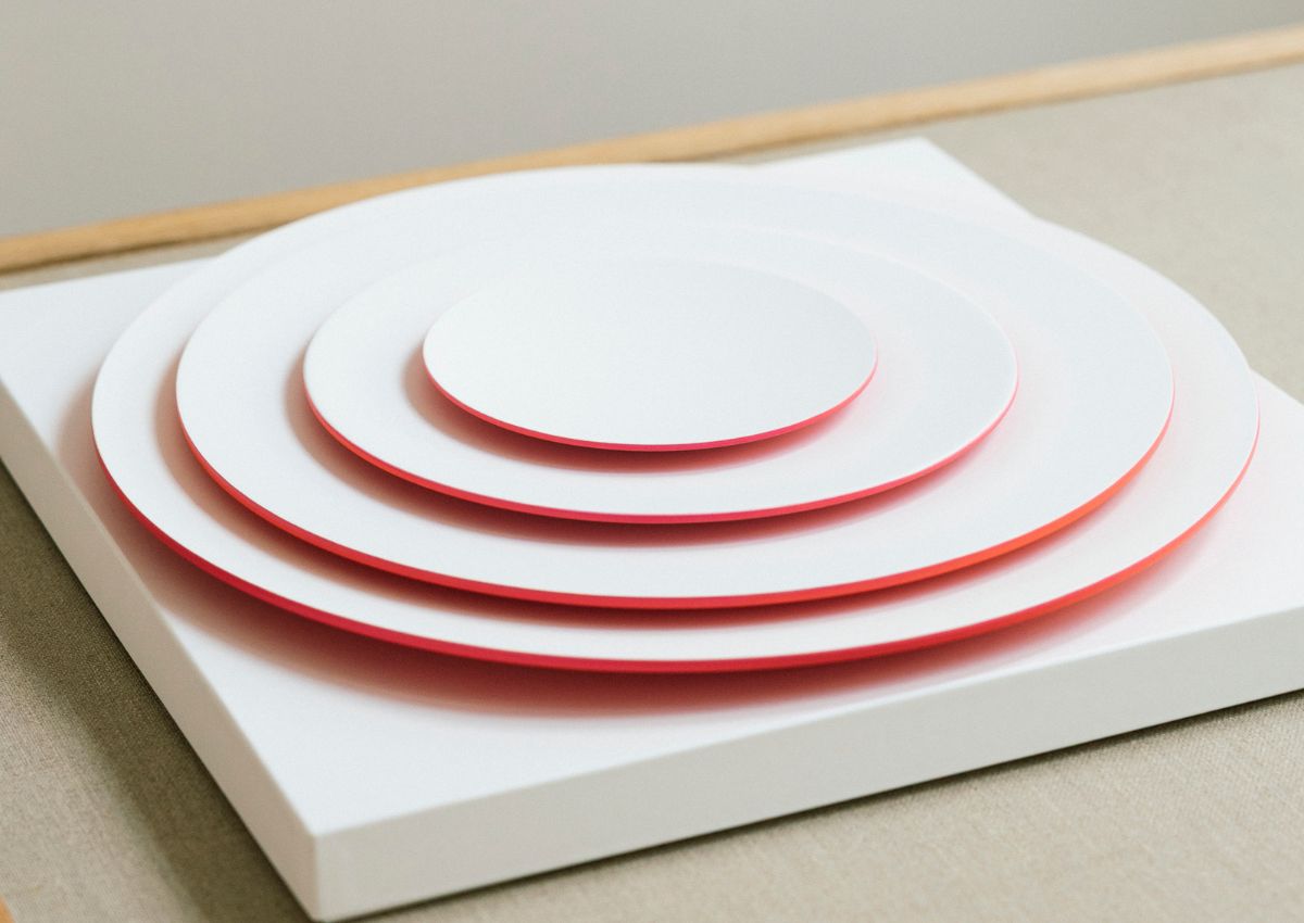 Plates with colourful rims displayed at the Tokyo Sense pop-up store in Le Marais, Paris