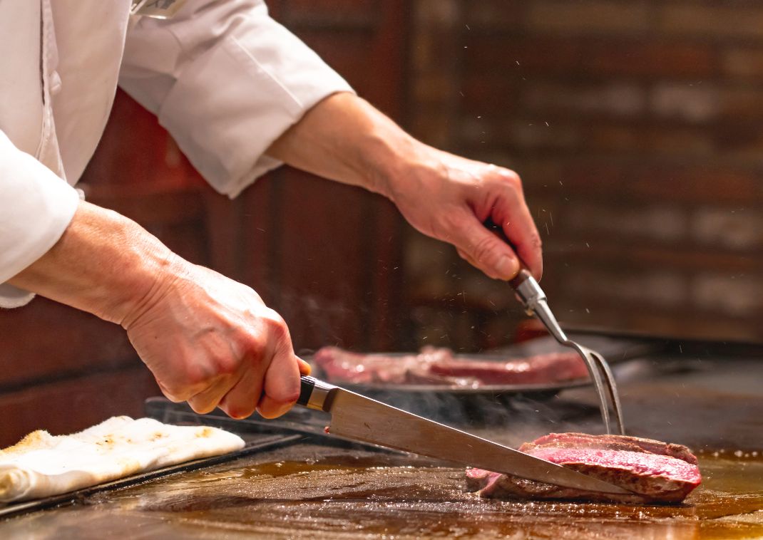 Japanese chef preparing wagyu beef teppanyaki style