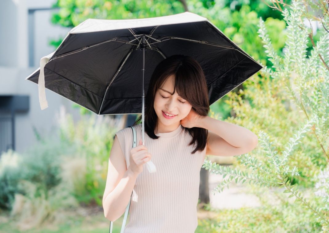 Asian woman with a parasol.
