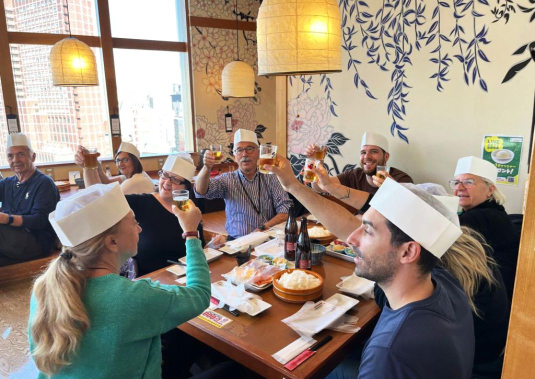 Group tour organised by Japanspecialist learning how to make sushi