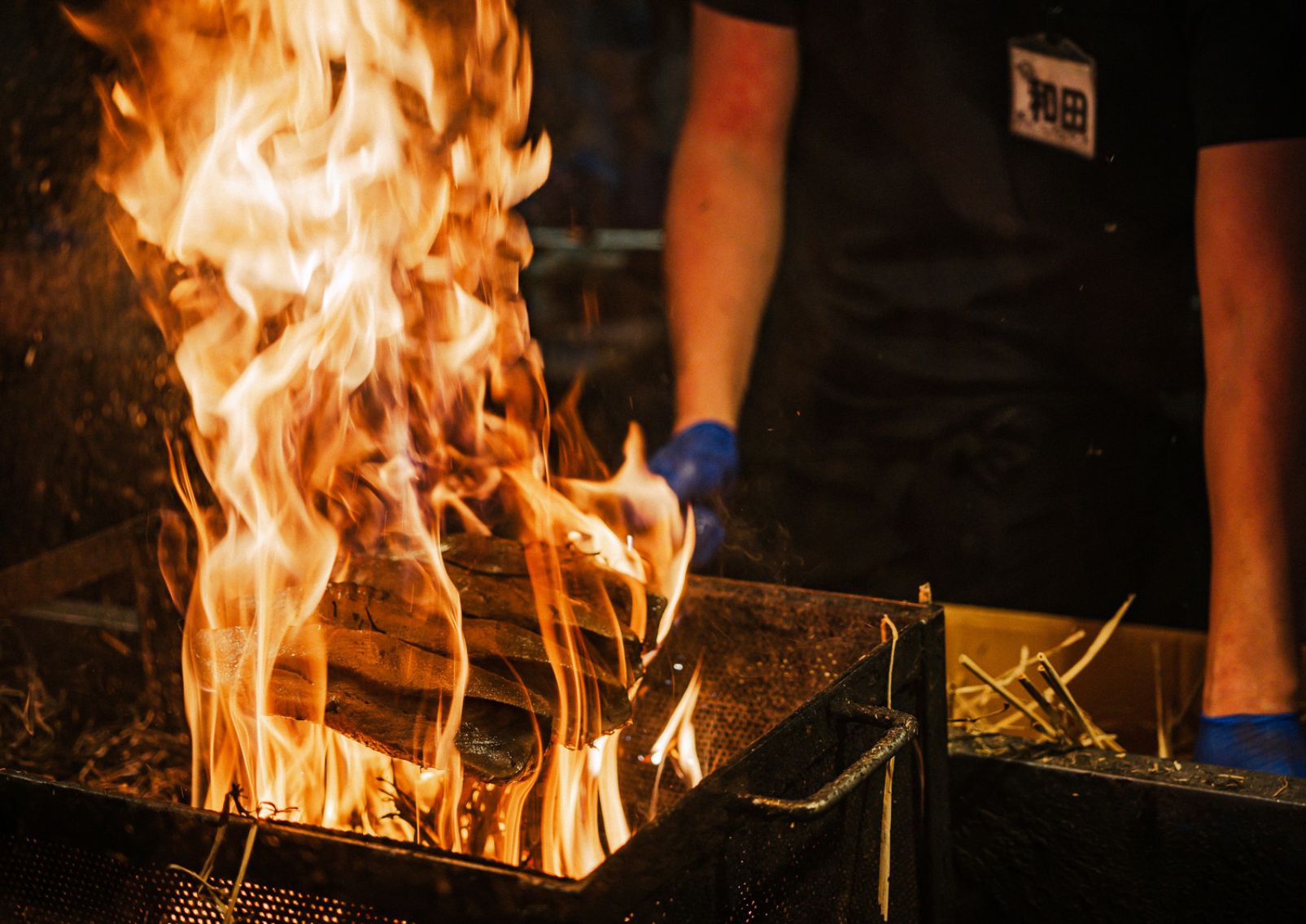  Grilling katsuo tataki over a fire at Hirome Market in Kochi