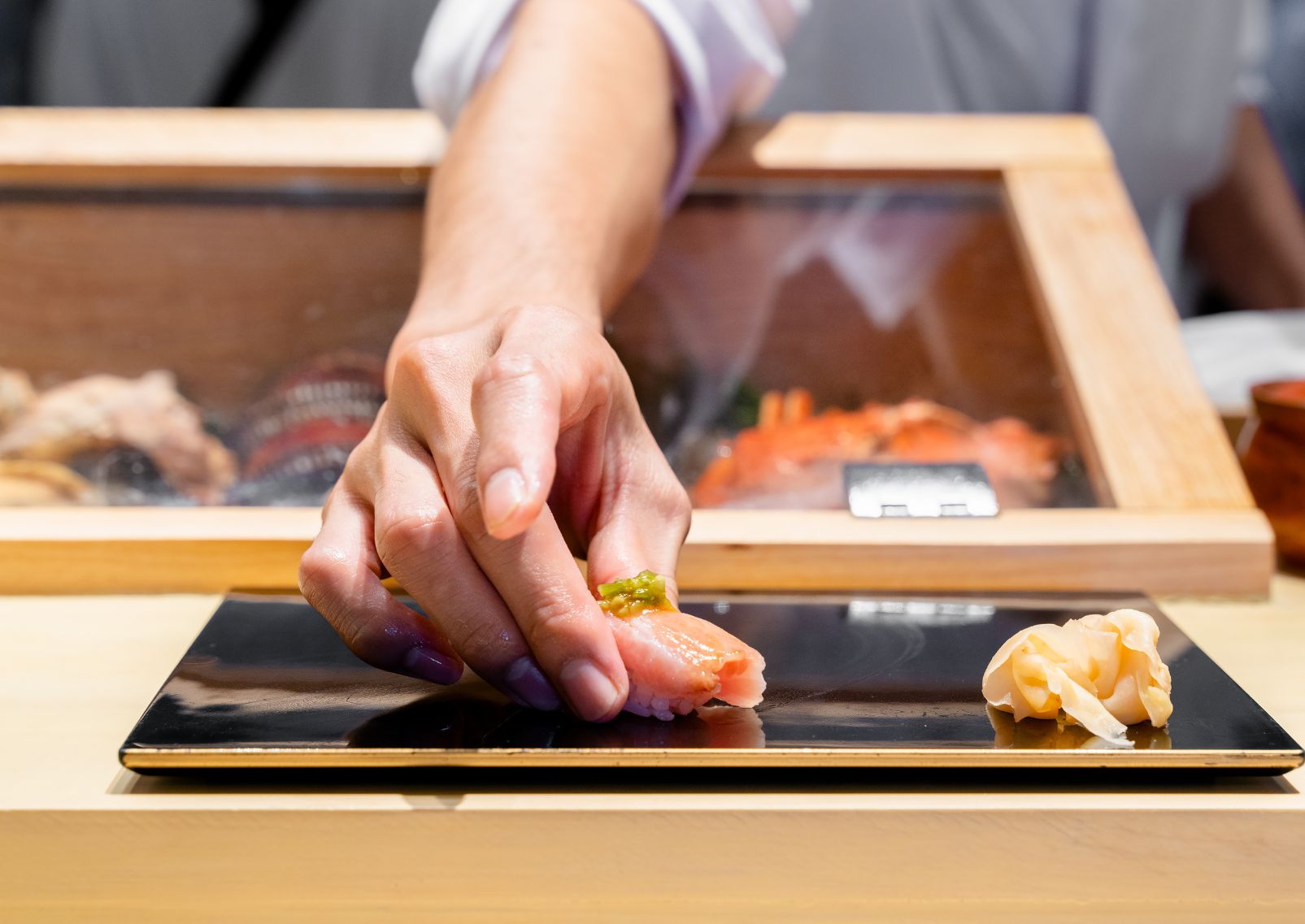 Japanese sushi with avocado and salmon, served with soy sauce