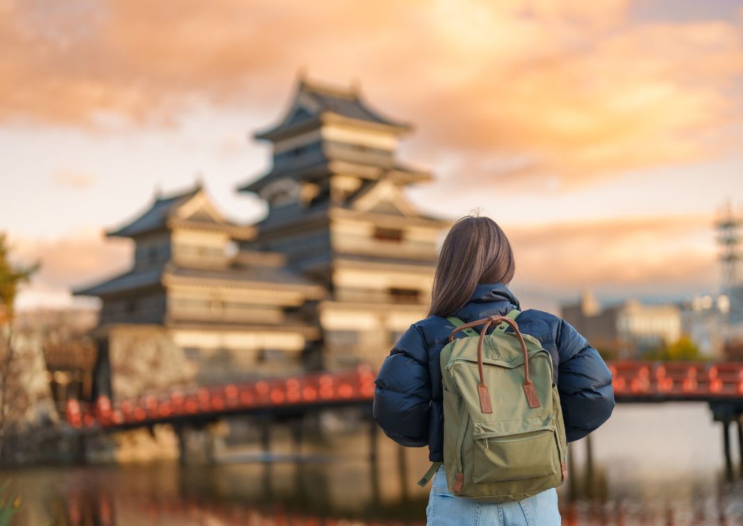 Lady looking at Matsumoto Castle in Japan